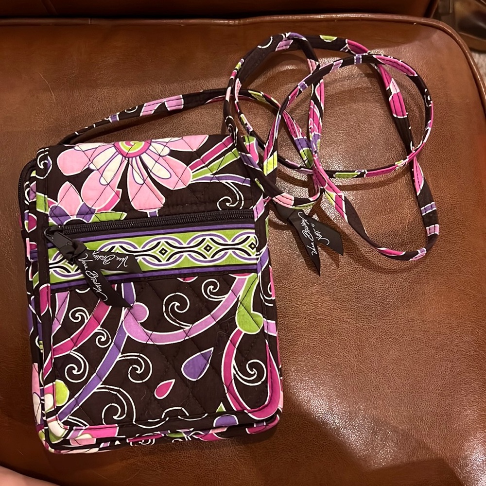 Very Bradley crossbody. Brown background. Pink and purple multicolored pattern.